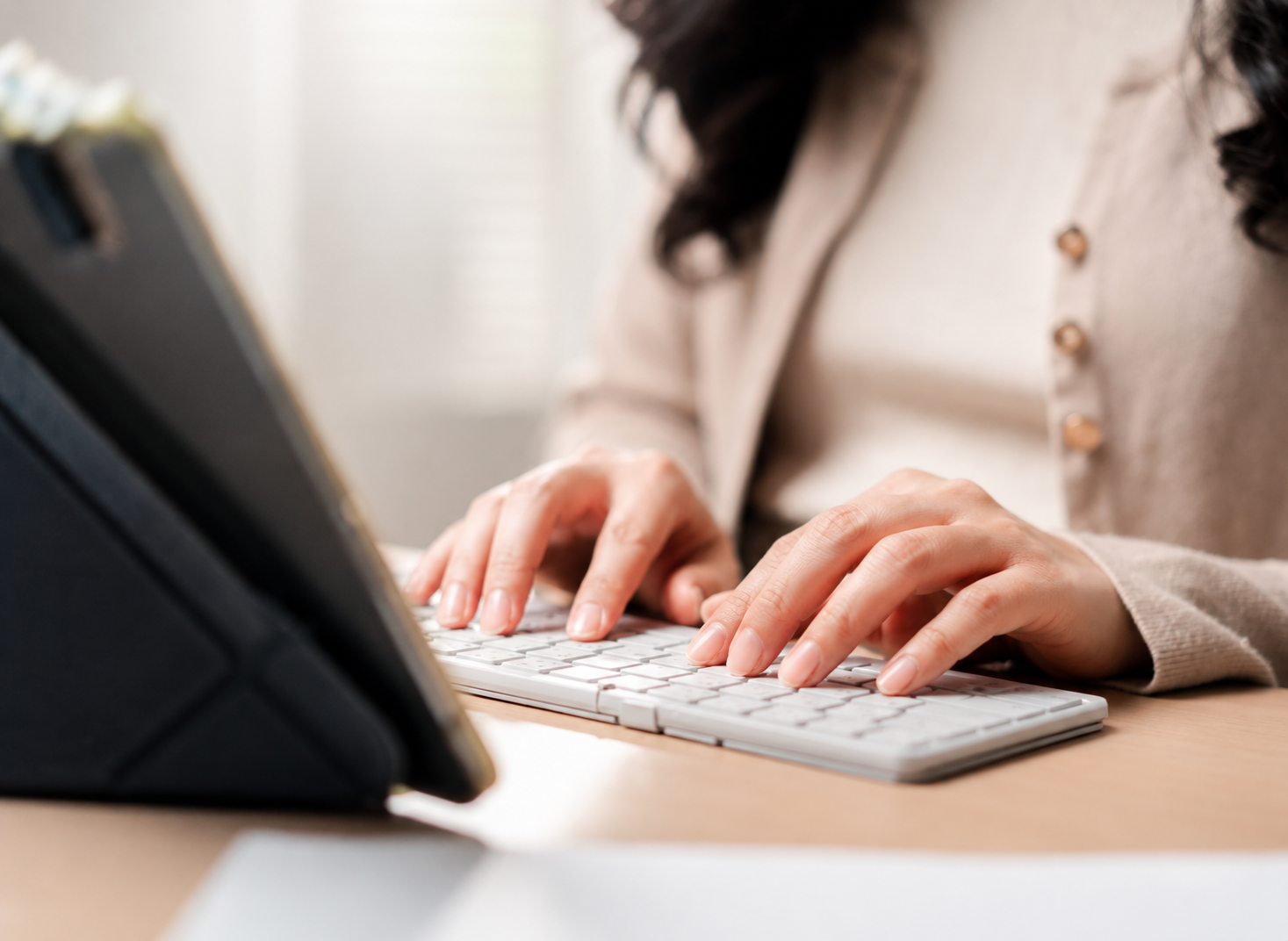 Person typing on laptop